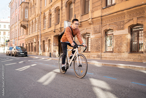 A man on a business bicycle goes to work urban eco transport © muse studio