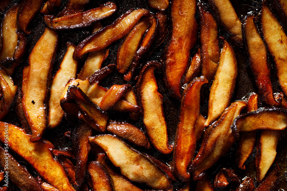 Fried sliced shiitake mushrooms, close up view Fried sliced shiitake mushrooms, close up view