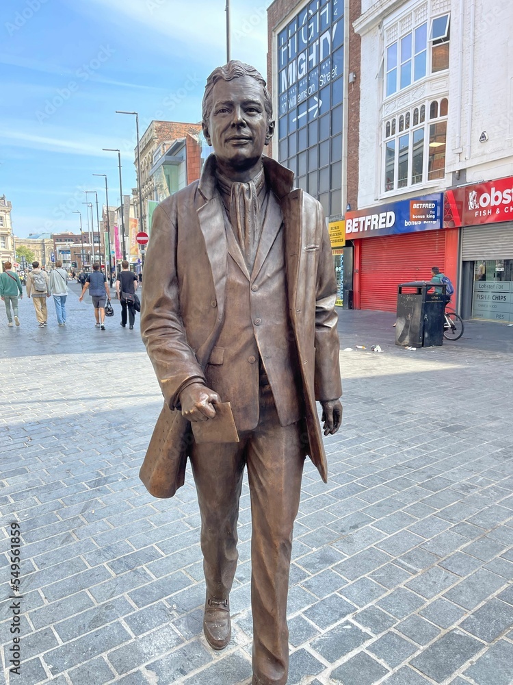 Vertical shot of the statue of Brian Epstein in Whitechapel Liverpool