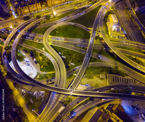 Aerial view of lighted highway road junctions at night