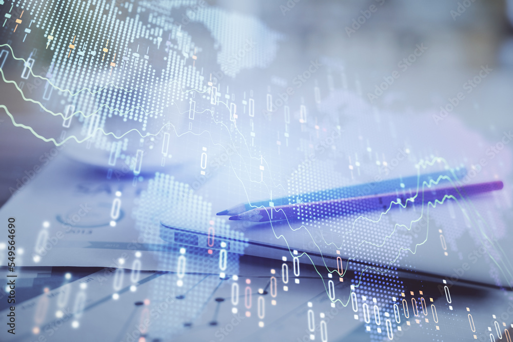 Forex graph hologram on table with computer background. Double exposure. Concept of financial markets. Forex graph hologram on table with computer background. Double exposure. Concept of financial markets.