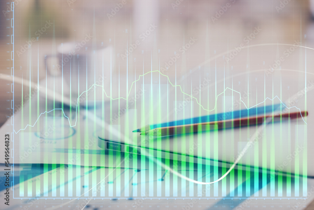 Obraz premium Forex graph hologram on table with computer background. Double exposure. Concept of financial markets.
