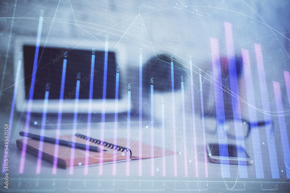 Forex graph hologram on table with computer background. Multi exposure. Concept of financial markets. Forex graph hologram on table with computer background. Multi exposure. Concept of financial markets.
