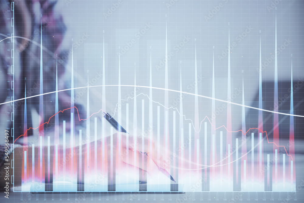 A woman hands writing information about stock market in notepad. Forex chart holograms in front. Concept of research. Double exposure A woman hands writing information about stock market in notepad. Forex chart holograms in front. Concept of research. Double exposure