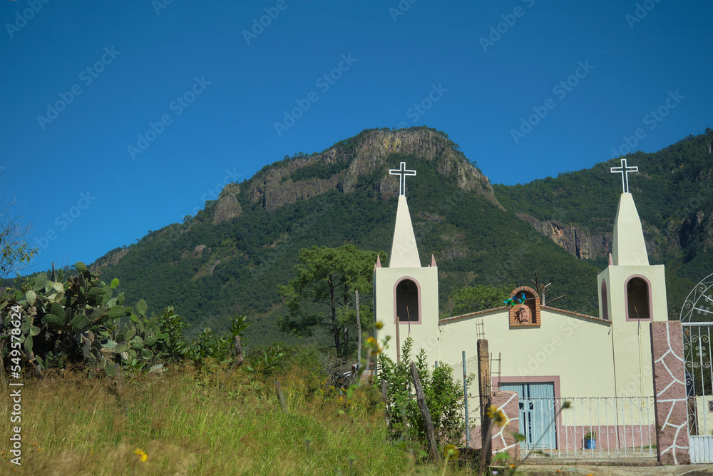 small colonial church in the mountains