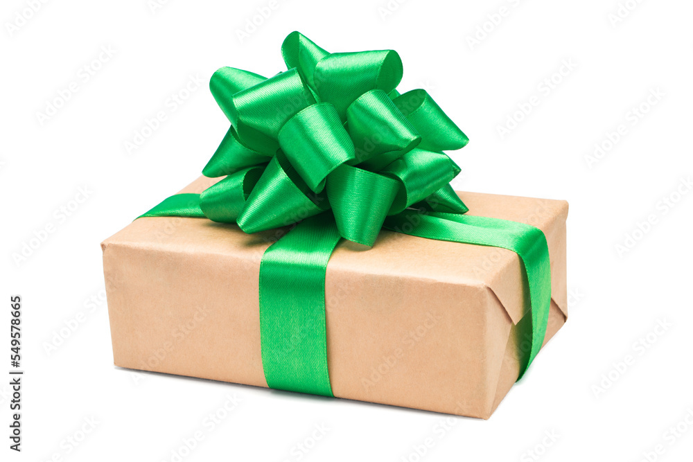 Close up shot of gift box wrapped in kraft paper and decorated with green satin ribbon bow, isolated on white background Close up shot of gift box wrapped in kraft paper and decorated with green satin ribbon bow, isolated on white background