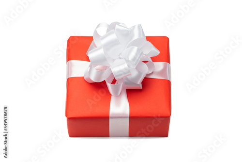 Close up shot of gift box wrapped in red paper and decorated with satin ribbon bow, isolated on white background