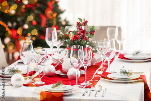 Beautiful table setting for Christmas dinner in living room