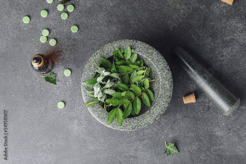 Different herbs in mortar a...