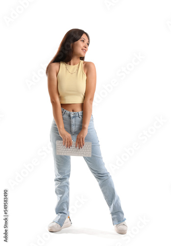 Young woman holding computer keyboard, digital communication and technology, online learning and remote work