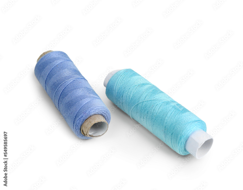 Blue thread spools isolated on white background Blue thread spools isolated on white background