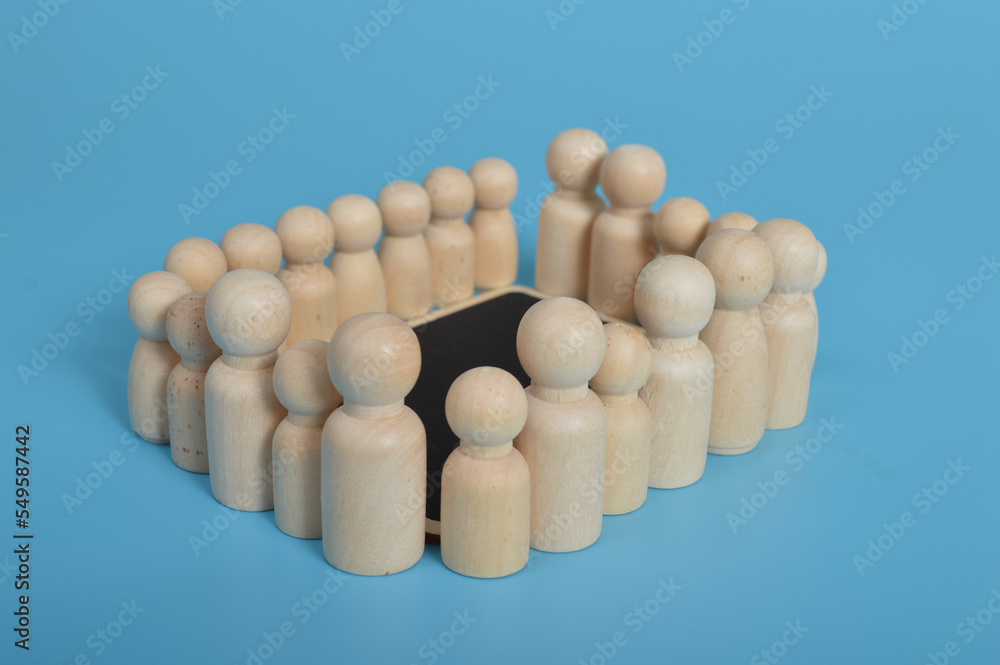 Wooden people of figures standing together. Business circle, business cooperation, brainstorming, discussing and analyzing and planning business strategy concept. Wooden people of figures standing together. Business circle, business cooperation, brainstorming, discussing and analyzing and planning business strategy concept.