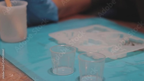 person preparing epoxy resin