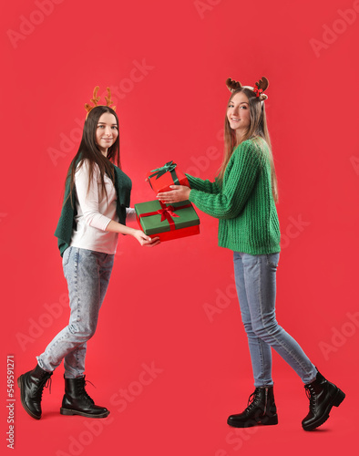 Two young women exchanging ...