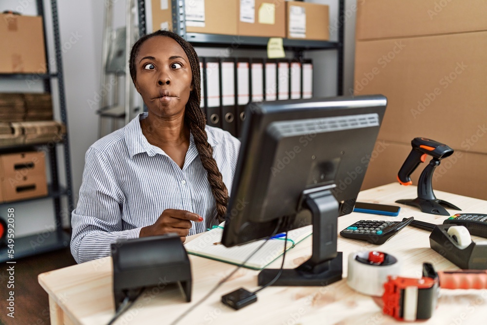 African woman working at small business ecommerce making fish face with lips, crazy and comical gesture. funny expression. African woman working at small business ecommerce making fish face with lips, crazy and comical gesture. funny expression.
