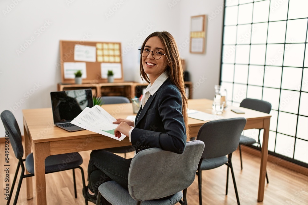 Young hispanic woman business worker smiling confident working at office
