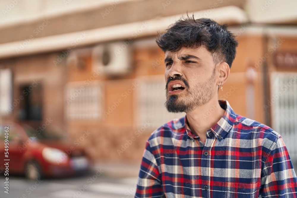 Young hispanic man angry screaming at street Young hispanic man angry screaming at street