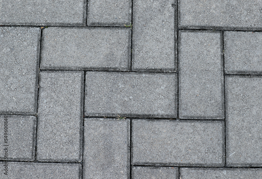Gray color paving slabs in the city, pedestrian street Gray color paving slabs in the city, pedestrian street