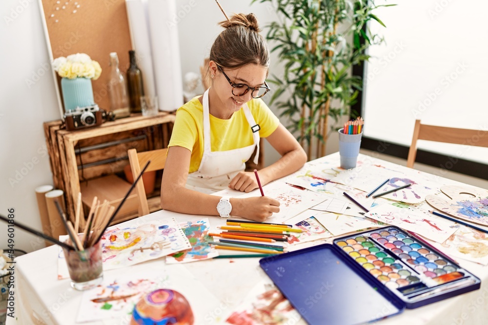 Adorable girl smiling confident drawing at art studio Adorable girl smiling confident drawing at art studio
