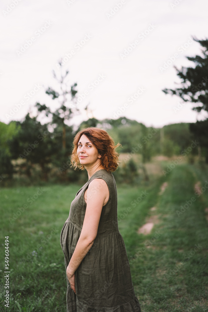A beautiful pregnant woman outdoors, happily expecting a baby and a happy time of pregnancy. Concepts of pregnancy and family. Motherhood. Pregnant belly. Awaiting baby A beautiful pregnant woman outdoors, happily expecting a baby and a happy time of pregnancy. Concepts of pregnancy and family. Motherhood. Pregnant belly. Awaiting baby