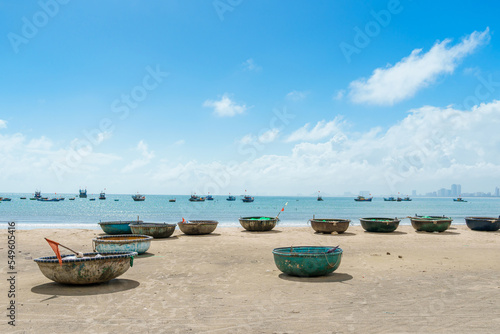 Basket boats at My Khe beach in Da Nang city, Vietnam. Local fishing boats of Danang have become iconic to Vietnam. Southeast Asia travel concept