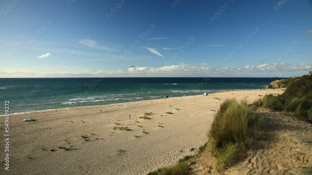 People Enjoying Summer Time On Magical Beach And Blue Seascape, Hayle, Cornwall, England People Enjoying Summer Time On Magical Beach And Blue Seascape, Hayle, Cornwall, England