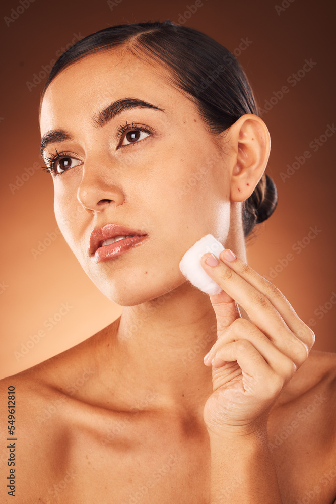 Woman, skincare beauty and cotton for face, health and cleaning for cosmetic glow by brown studio backdrop. Model, cottonwool and skin with moisturiser, wellness and natural cosmetics by backdrop