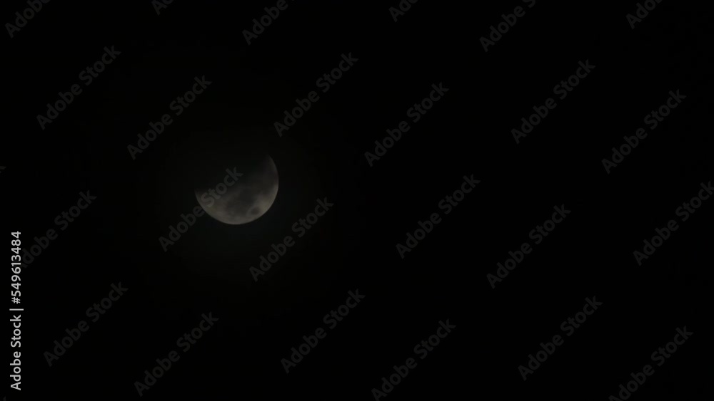 Partial Lunar Eclipse with Clouds Rolling over it - 11-08-2022 - Moon in half shadow Partial Lunar Eclipse with Clouds Rolling over it - 11-08-2022 - Moon in half shadow
