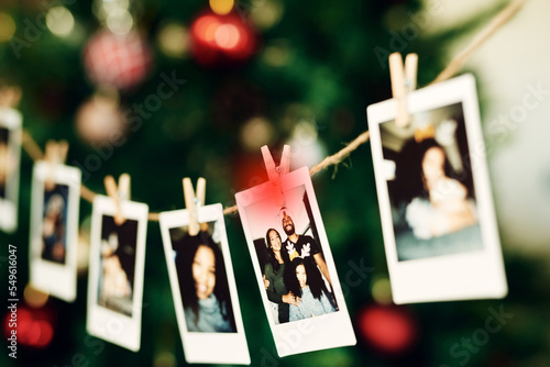 Fototapeta Christmas, family and photo hanging for decoration on peg line for festival, tradition and vacation at home