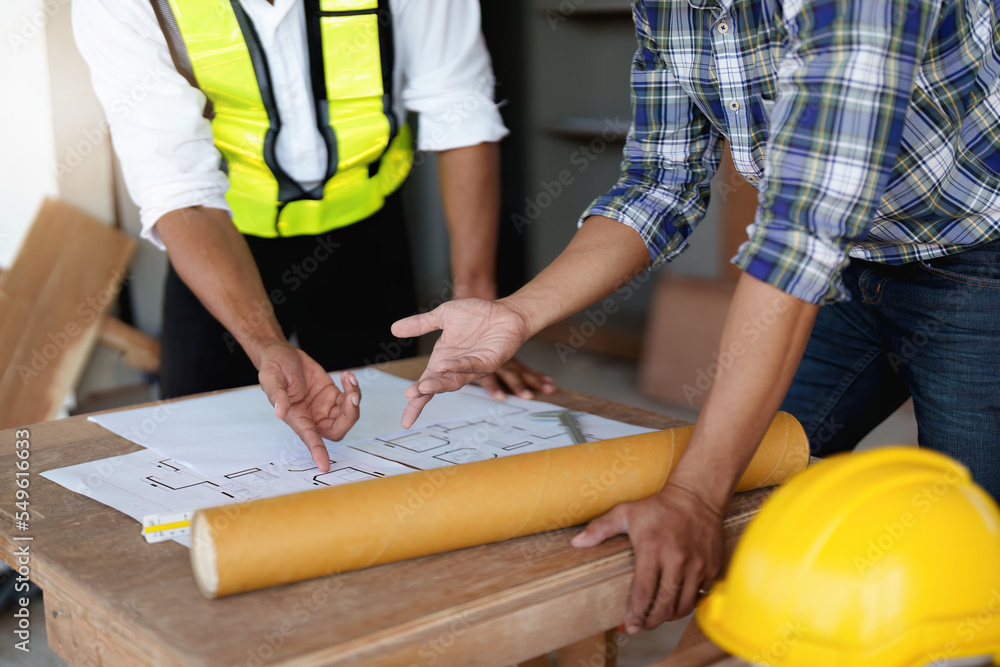 Professional architect designer structural engineer team colleagues discussing building plan design project Professional architect designer structural engineer team colleagues discussing building plan design project
