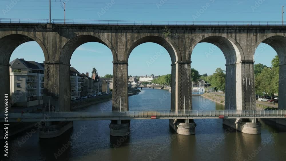 Drone passing under railway bridge in Laval, Mayenne, France. Aerial forward Drone passing under railway bridge in Laval, Mayenne, France. Aerial forward