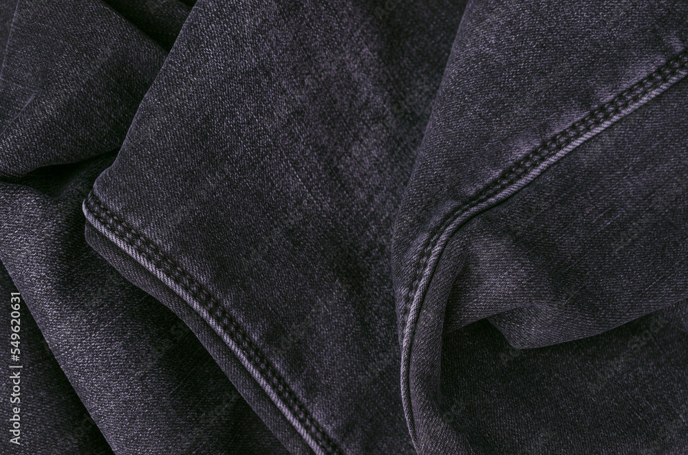 Part of dark jeans. Part of dark jeans.