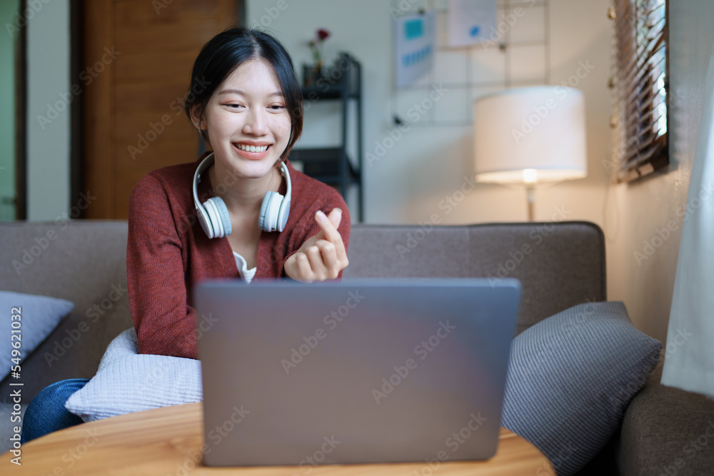 Portrait of a beautiful Asian teenage girl using a computer Portrait of a beautiful Asian teenage girl using a computer