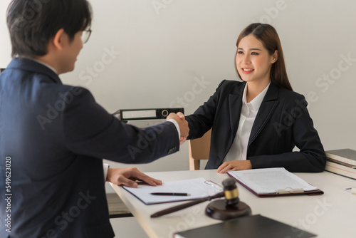 Wallpaper Mural Law concept, Businessman shaking hands with female lawyer after deal and agreement contract Torontodigital.ca