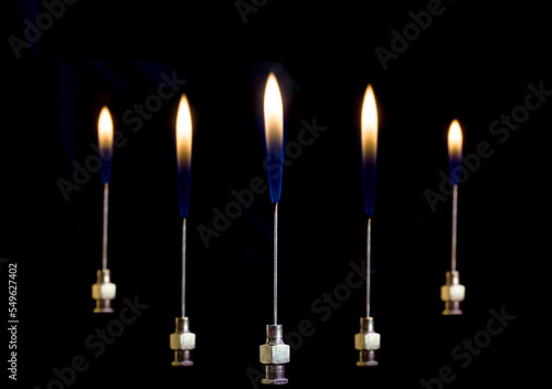 Gas flare burning from an injection needle