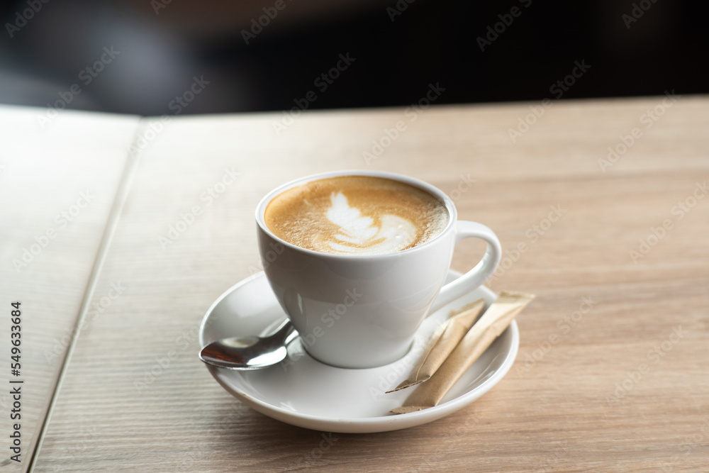 Cup of coffee in cafe on light background Cup of coffee in cafe on light background