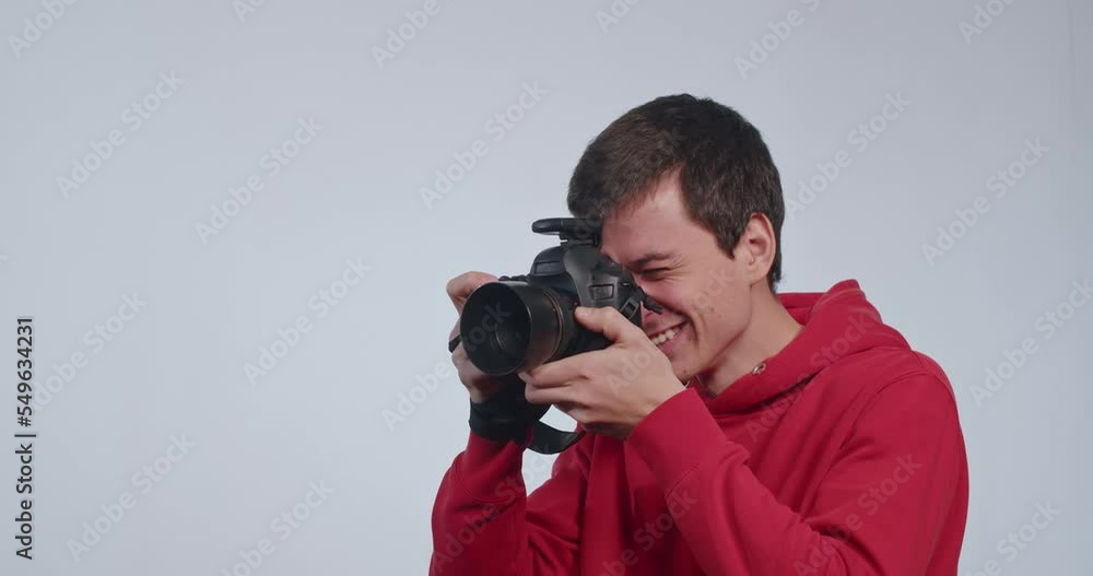 happy guy photographer professional shoots model in studio, behind the scenes. happy guy photographer professional shoots model in studio, behind the scenes.