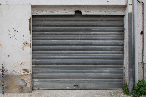 steel sequential old and worn metal garage door