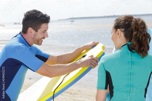 a couple of bodyboard surfers