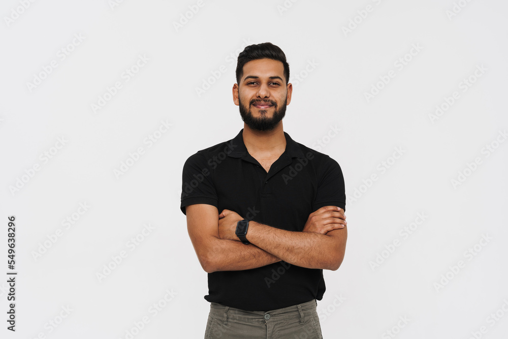 Portrait of middle aged indian man in black polo isolated Portrait of middle aged indian man in black polo isolated
