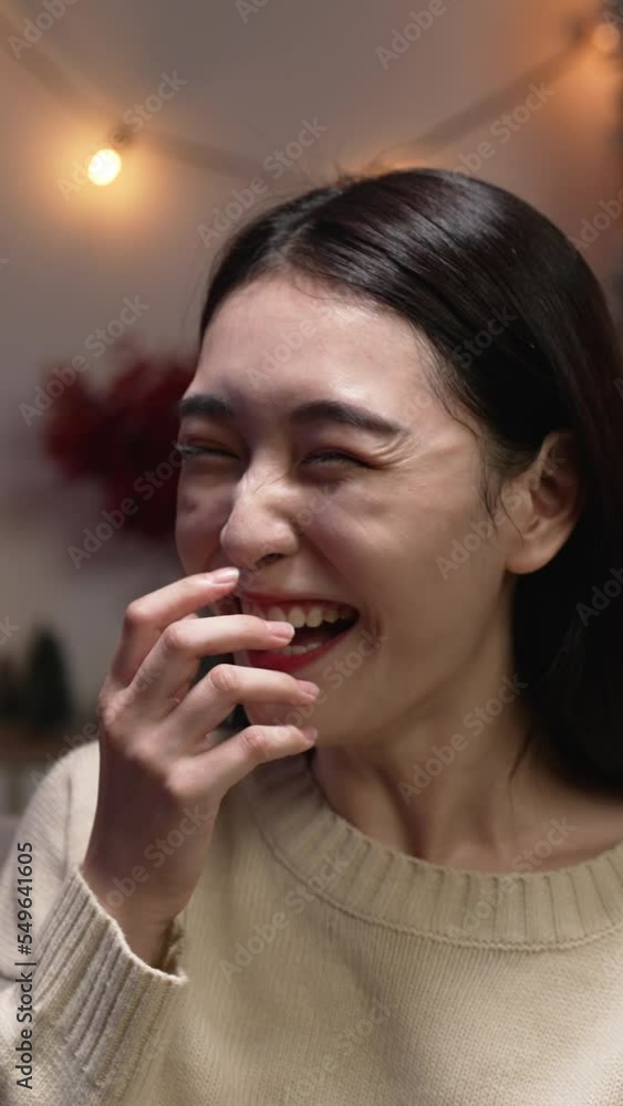Vertical Screen: excited asian woman open mouth in huge laughing while hand giving xmas present. Happy millennial female satisfied receiving red box gift on valentines day at night on sofa Vertical Screen: excited asian woman open mouth in huge laughing while hand giving xmas present. Happy millennial female satisfied receiving red box gift on valentines day at night on sofa