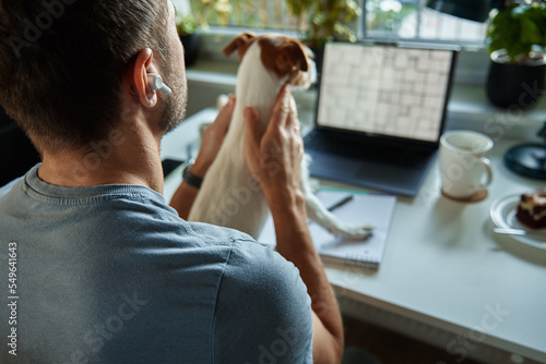Papier peint Freelancer working at home office with dog