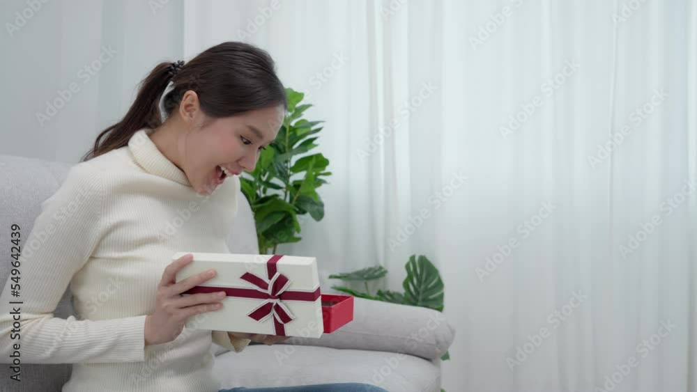 Pretty woman feeling surprise and look with interest inside box. cute girl excited open gift boxes. birthday surprise, bonus, Celebration , Gift xmas, Gift New year, anniversary, encourage, thank Gift
