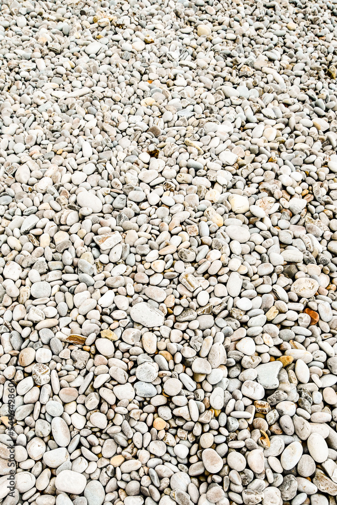 Obraz premium pebbles on the beach, photo as a background , in playa del silencio , silent beach, principado de asturias, spain europe