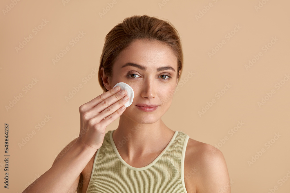 Woman Cleaning Face With White Pad. Beautiful Girl Removing Makeup White Cosmetic Cotton Pad. Happy Female Taking Off Makeup From Facial Skin With Cosmetic Pad. Hight Quality Image Woman Cleaning Face With White Pad. Beautiful Girl Removing Makeup White Cosmetic Cotton Pad. Happy Female Taking Off Makeup From Facial Skin With Cosmetic Pad. Hight Quality Image