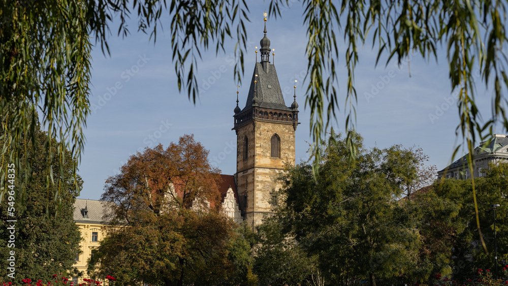 View of new town hall tower in prague, looking from the park on a sunny autumn day.