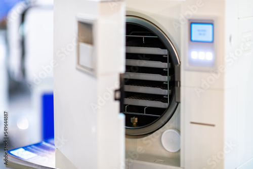 Sterilization desk with autoclave in a dental clinic.