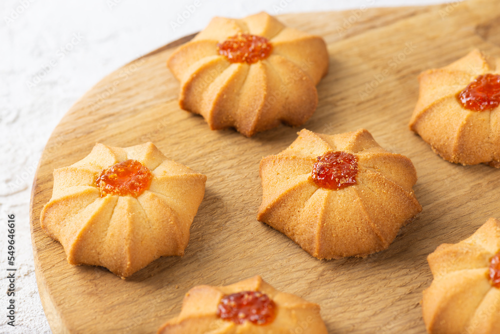 Sweet breakfast butter cookies for Chinese New Year on wooden board. Shortbread kurabye. Sweet breakfast butter cookies for Chinese New Year on wooden board. Shortbread kurabye.