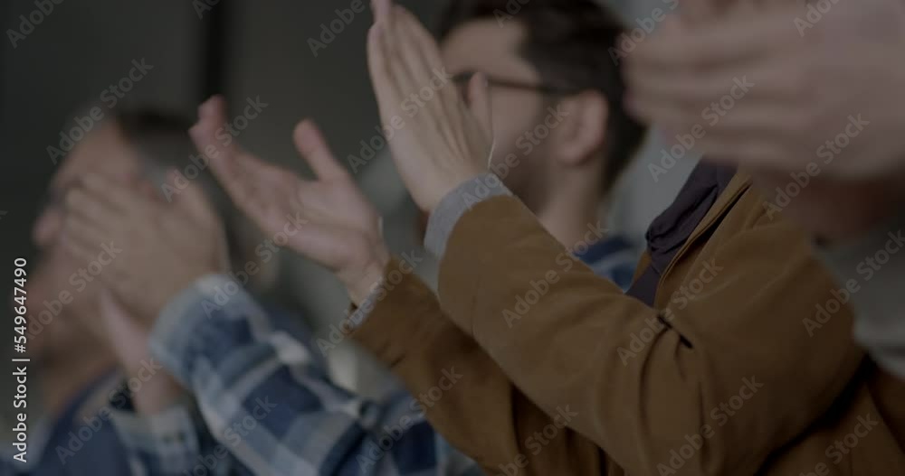 Close-up unrecognizable people clapping hands Close-up unrecognizable people clapping hands