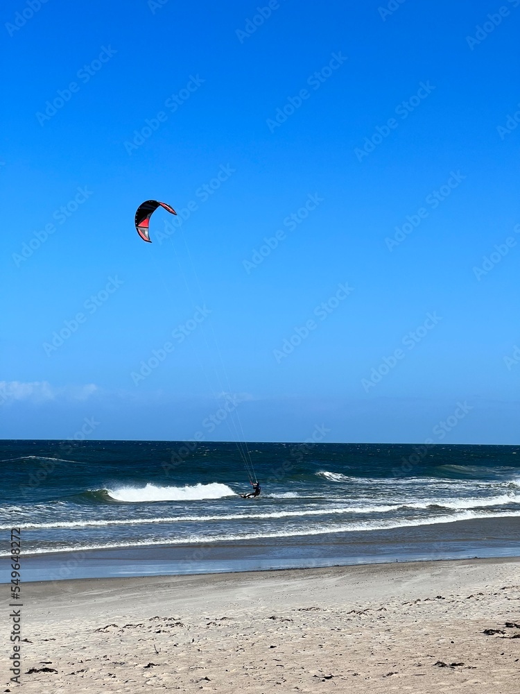 wide sandy beach blue sky with clouds visible waves over the baltic sea wide sandy beach blue sky with clouds visible waves over the baltic sea
